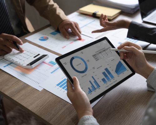 business adviser meeting to analyze and discuss the situation on the financial report in the meeting room.Investment Consultant, Financial advisor and accounting concept.